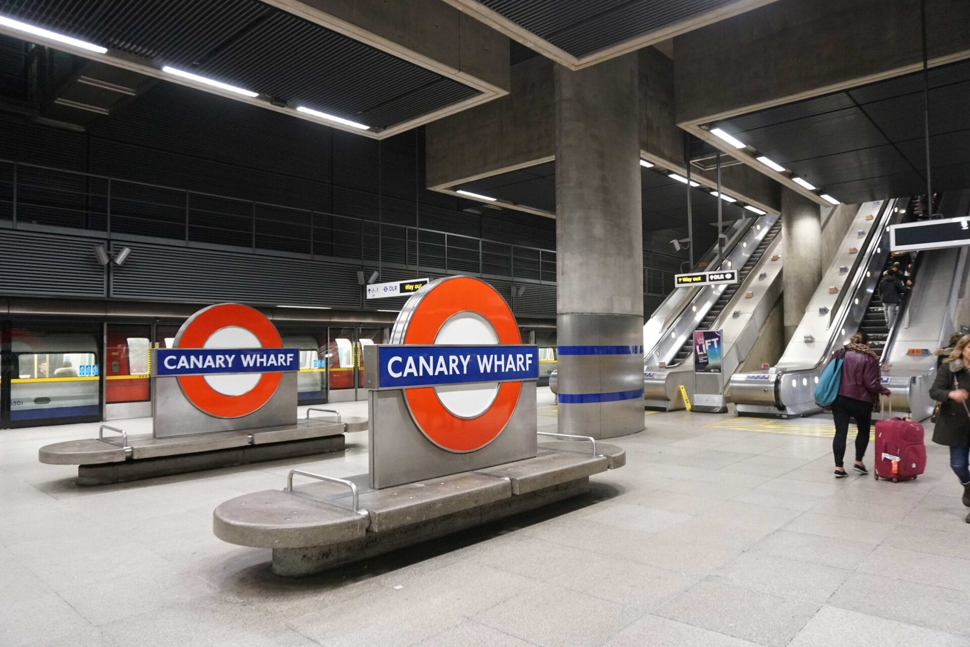Platforms and escalators at Canary Wharf Station.