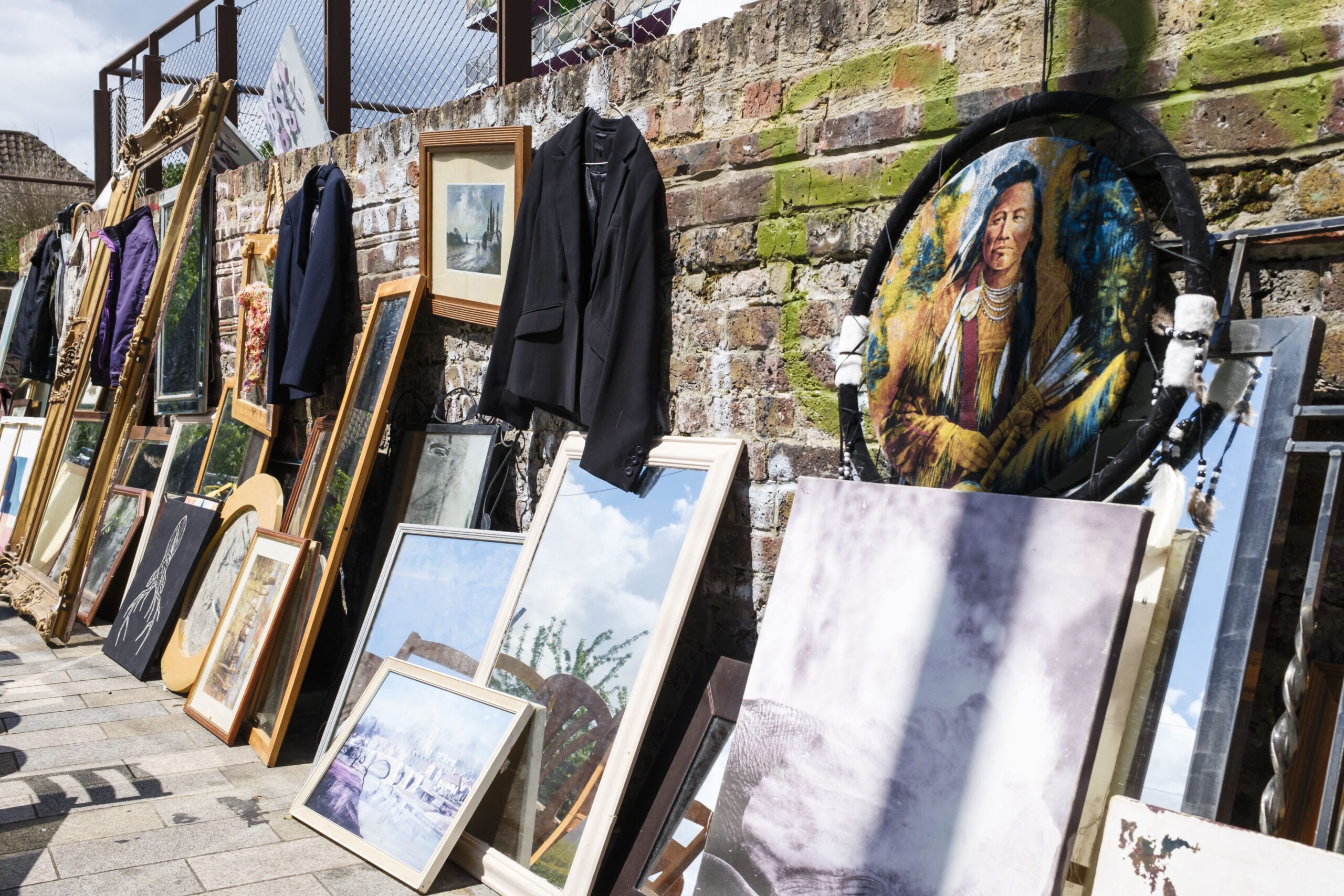 An image of various artworks and clothing for sale in Deptford