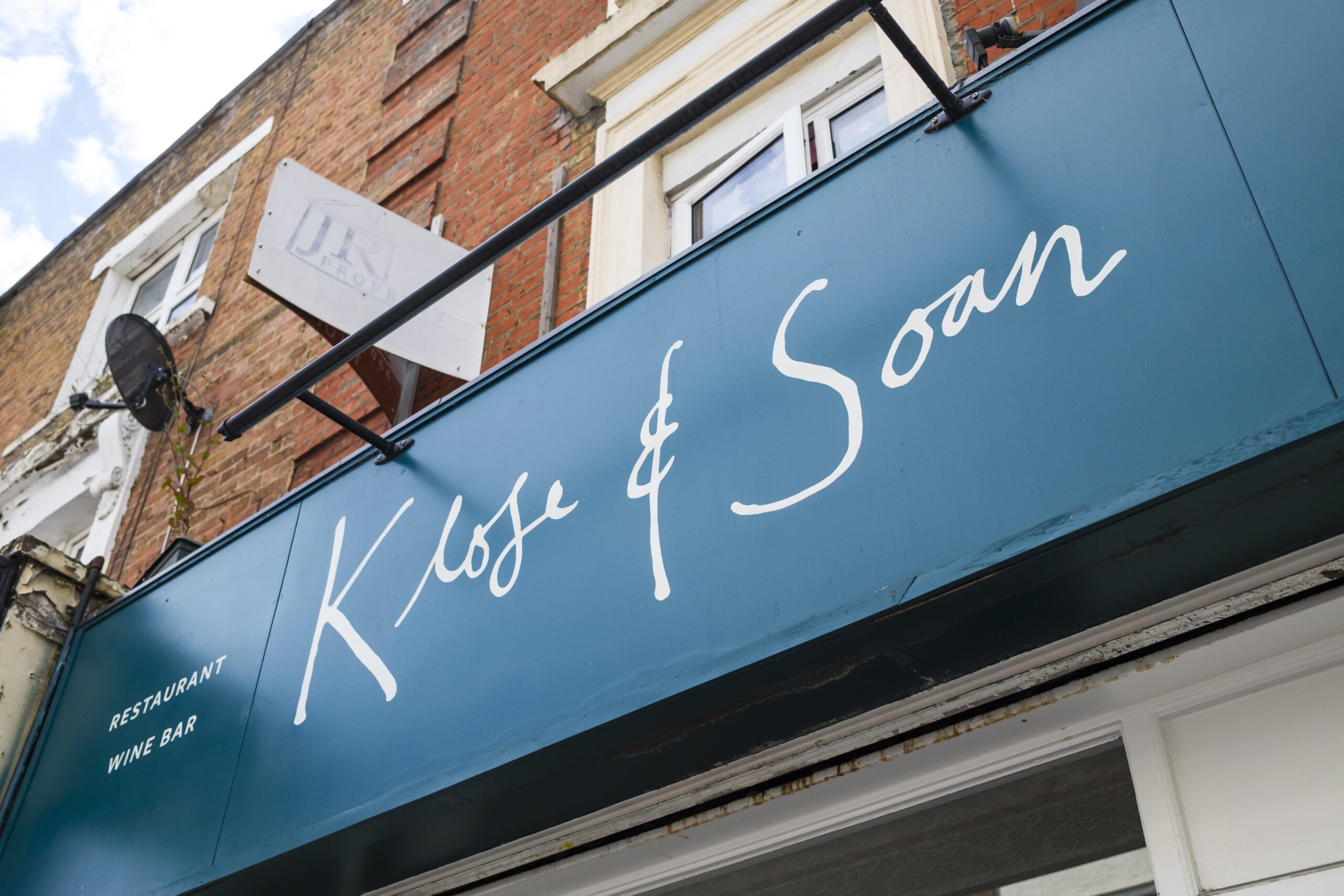 An outdoor shot of the entrance signage for the Klose & Soan restaurant/wine bar in Deptford.