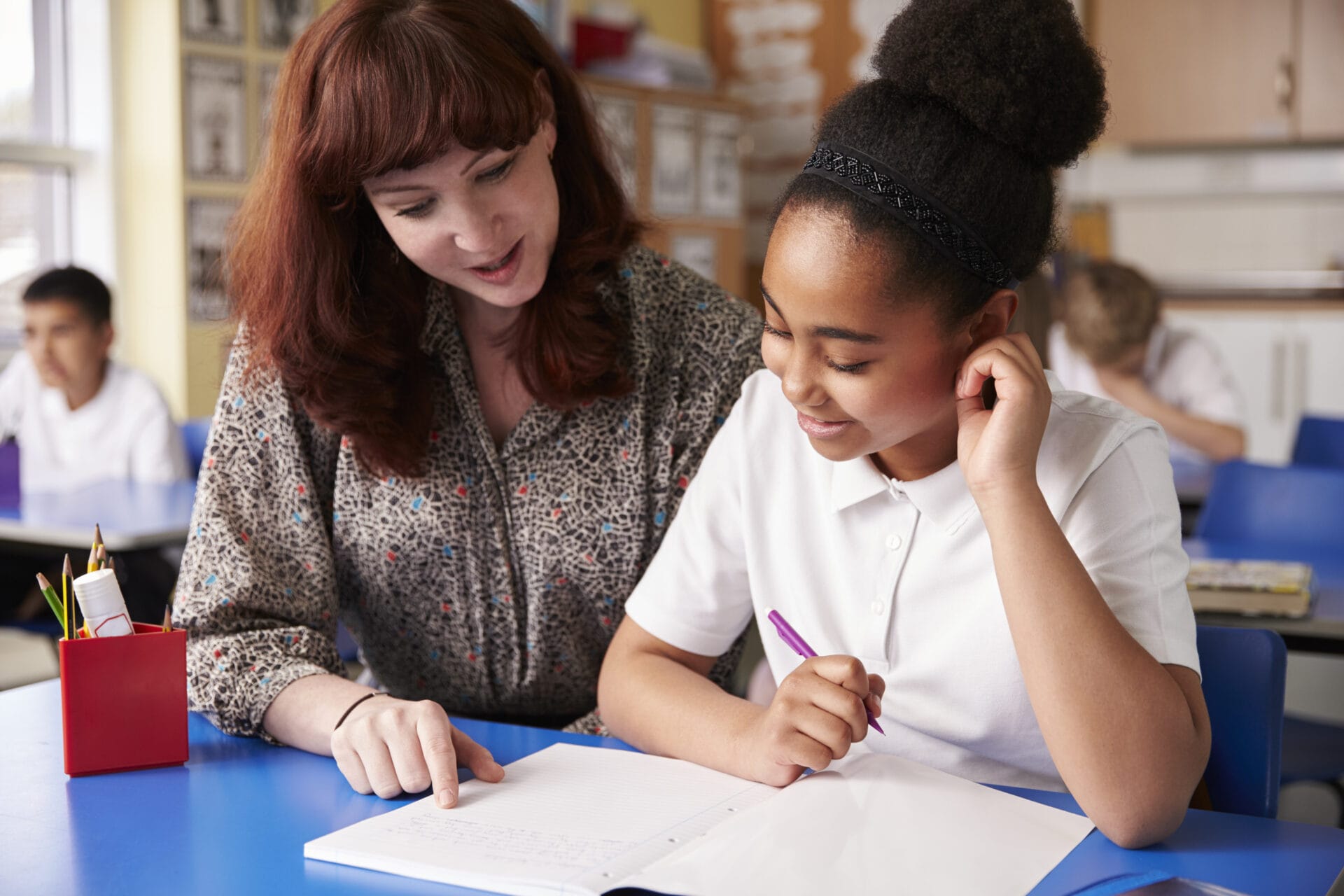 A teacher sat with a student.