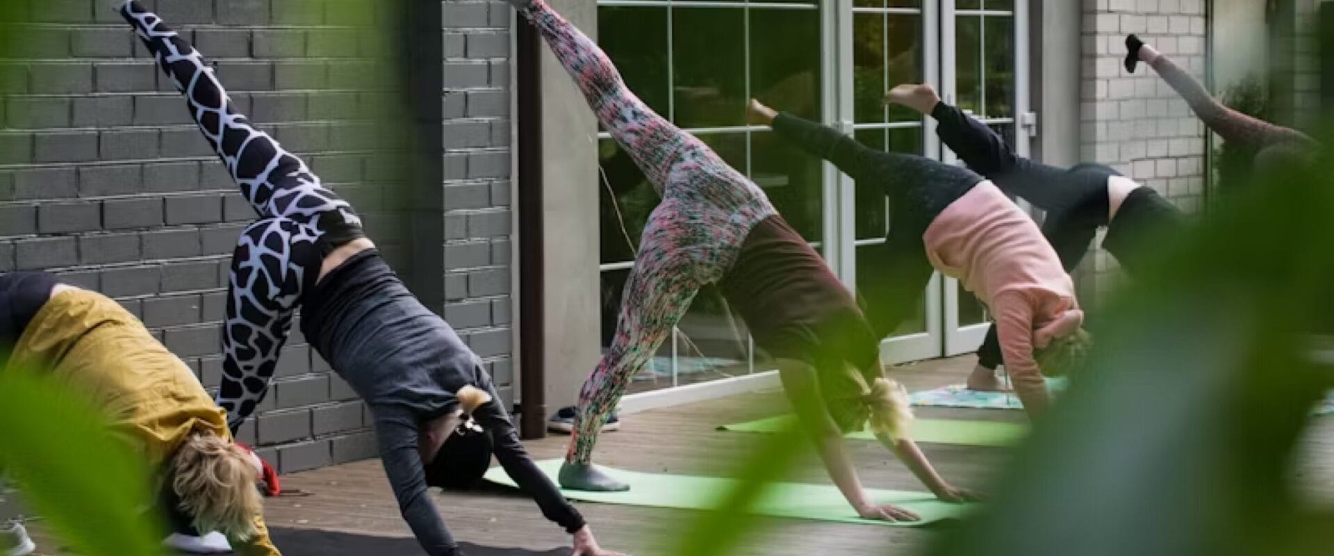 People doing yoga outdoors.
