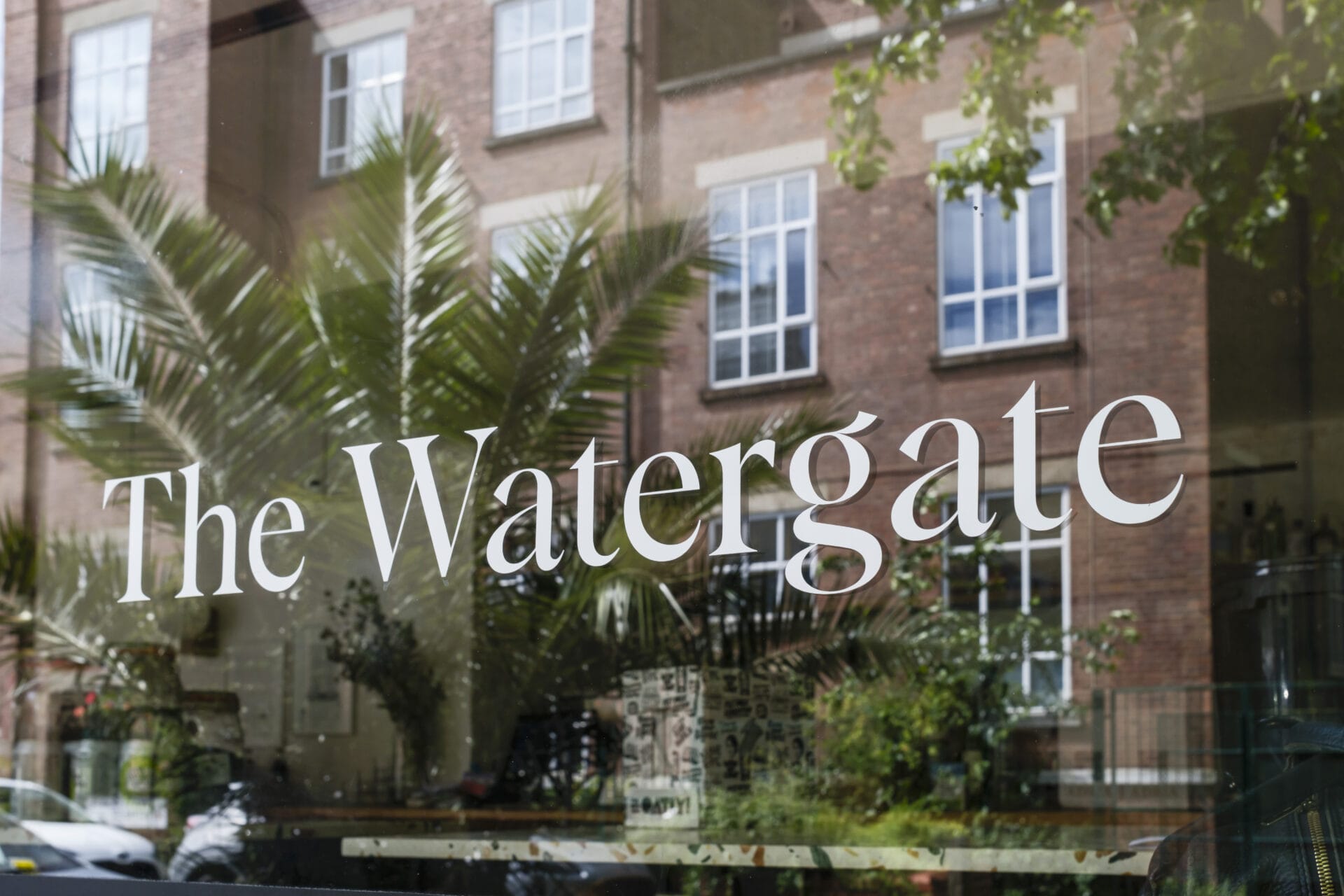 The logo of The Watergate restaurant on their window.