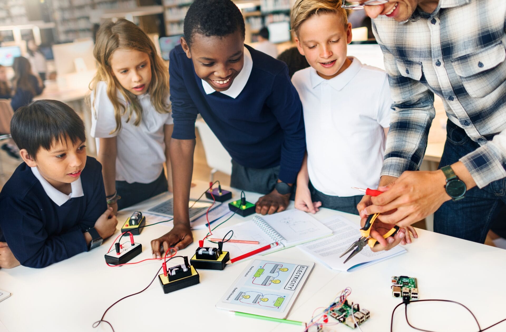 A group of school children learning about electricity.