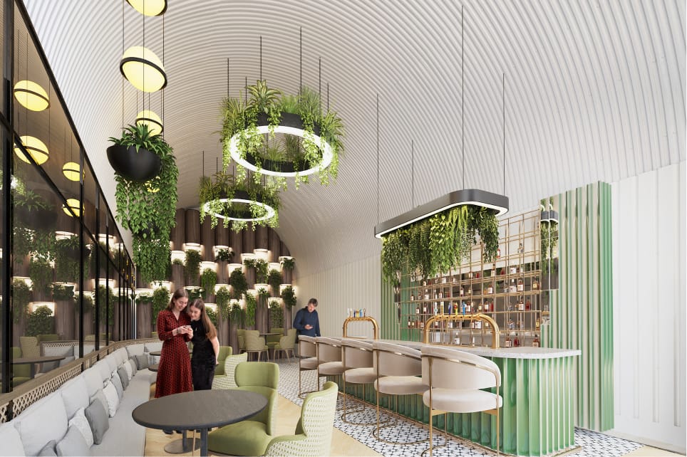 A modern bar with curved ceilings, overhead ring lights and lots of plants.