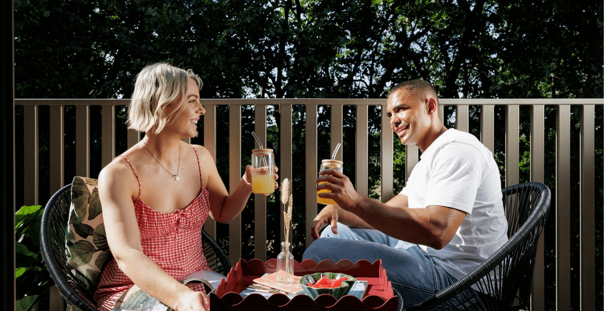 Couple on their Neptune Wharf balcony