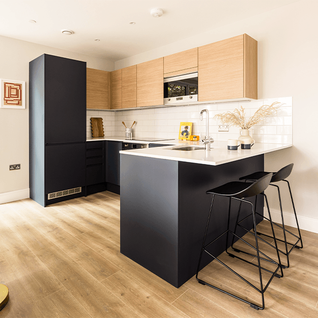 A kitchen area with breakfast abr at Neptune Wharf